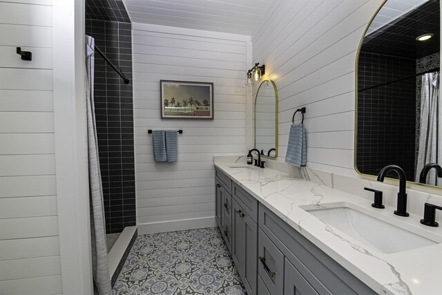 16/18/20 Inlet Pl, Saint Augustine, FL 32080 - full bath with a tile shower, double vanity, and wood walls