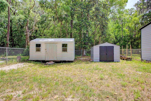 view of shed featuring a fenced backyard