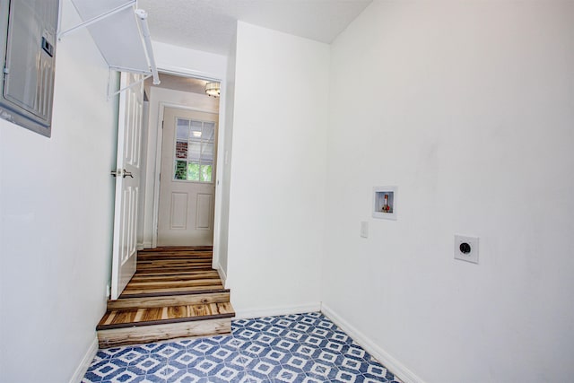 laundry area featuring electric panel, hookup for an electric dryer, baseboards, hookup for a washing machine, and laundry area