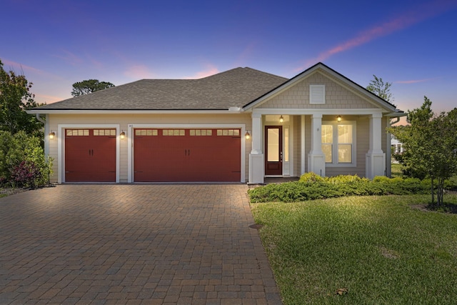 443 Pescado Dr, Saint Augustine, FL 32095 - view of front of property featuring a front yard, roof with shingles, decorative driveway, and an attached garage