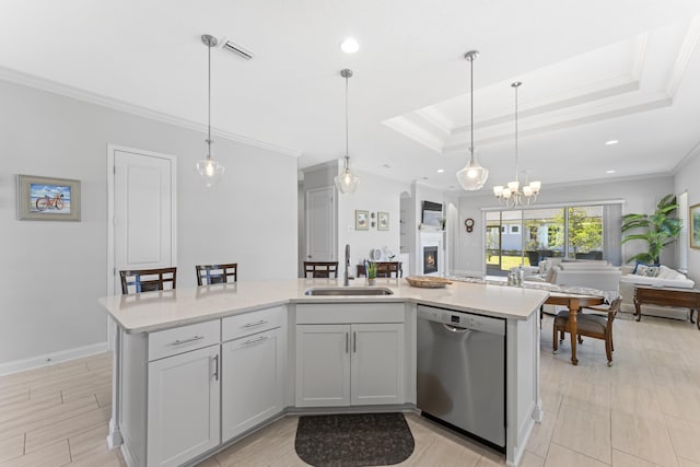 443 Pescado Dr, Saint Augustine, FL 32095 - kitchen with stainless steel dishwasher, open floor plan, a sink, and ornamental molding