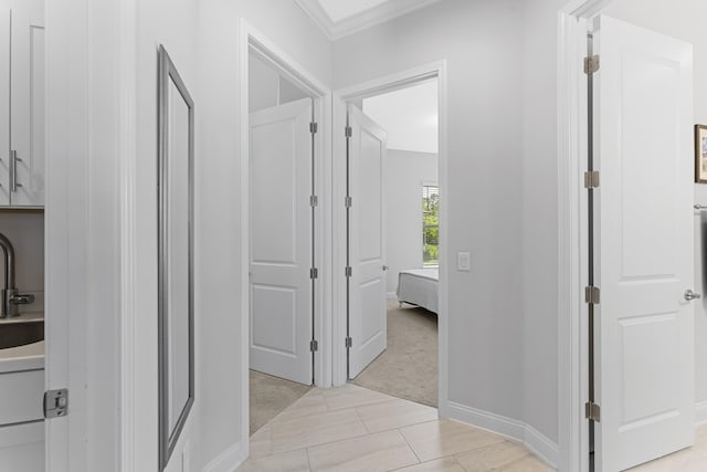 443 Pescado Dr, Saint Augustine, FL 32095 - hallway with light colored carpet and ornamental molding