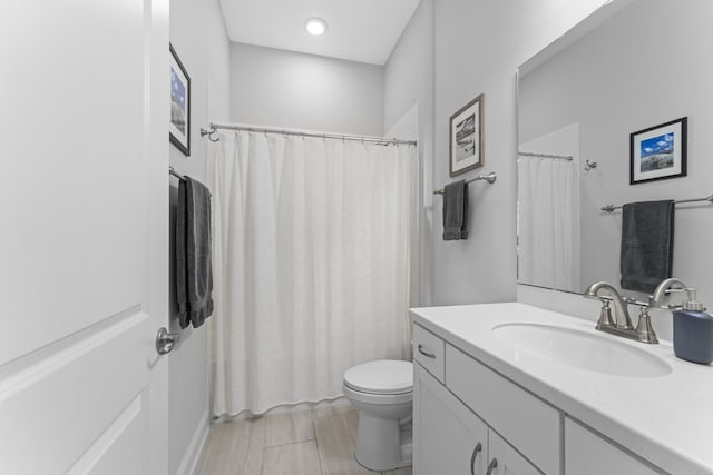 443 Pescado Dr, Saint Augustine, FL 32095 - full bathroom with toilet, vanity, and a shower with shower curtain