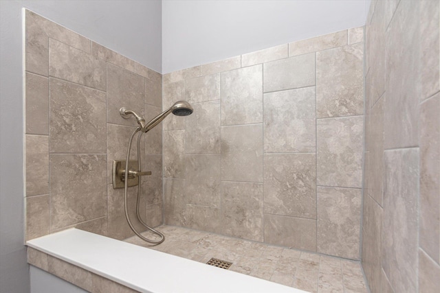 bathroom featuring a tile shower