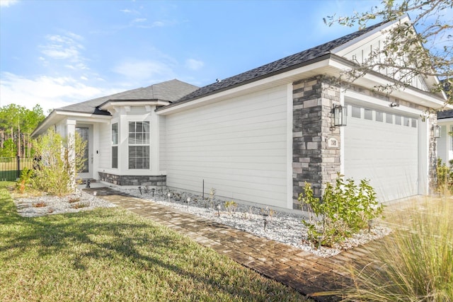 view of home's exterior featuring a yard and a garage