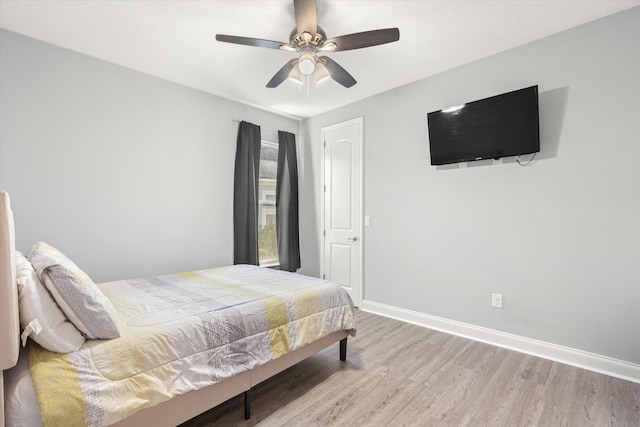 bedroom featuring ceiling fan and light hardwood / wood-style floors