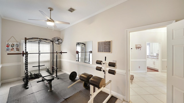 workout area featuring light tile patterned floors, baseboards, visible vents, and crown molding