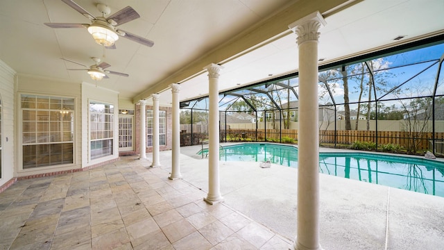 view of swimming pool with ceiling fan, a patio, a fenced backyard, a lanai, and a fenced in pool