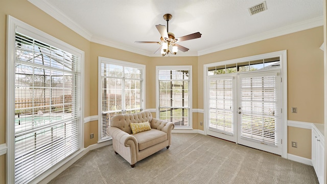 sunroom / solarium featuring visible vents and ceiling fan