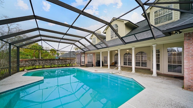 view of swimming pool with a lanai, a fenced in pool, and a patio