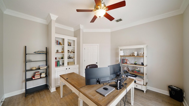 office featuring ceiling fan, wood finished floors, visible vents, baseboards, and ornamental molding