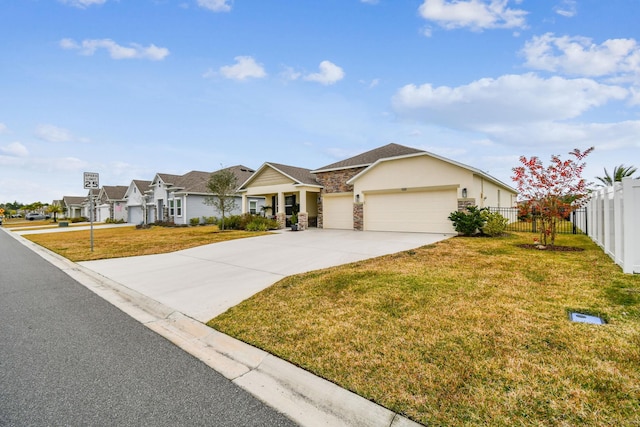 ranch-style home with a garage and a front yard