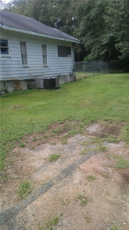 view of yard with central AC unit