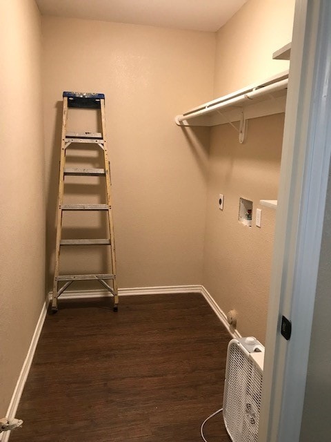 laundry area featuring hookup for a washing machine, hookup for an electric dryer, and dark wood-type flooring