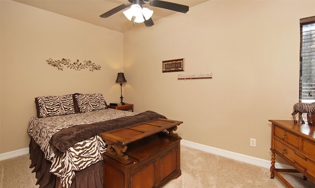 carpeted bedroom with ceiling fan and multiple windows