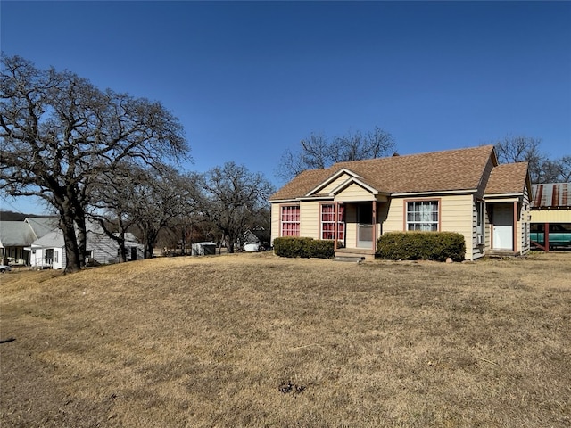 view of front of home with a front yard