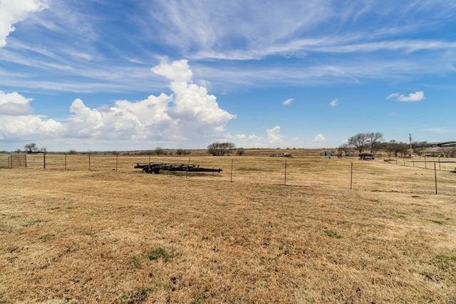 view of yard with a rural view