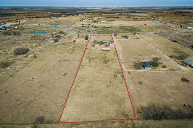 birds eye view of property featuring a rural view