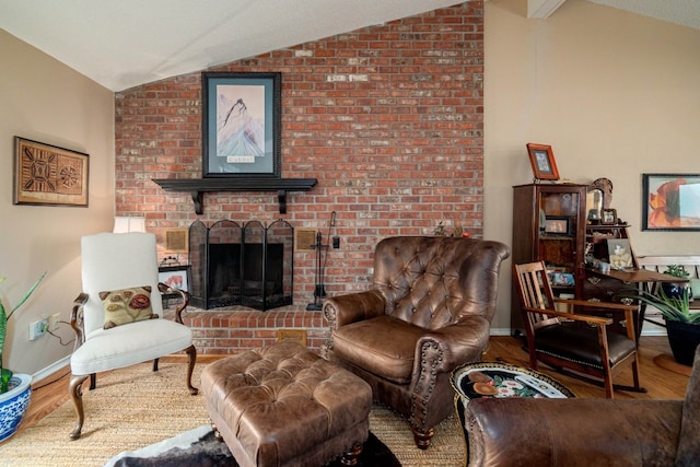 living room with a fireplace, lofted ceiling, and wood-type flooring