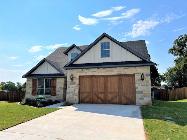 view of front of house featuring a front yard and a garage