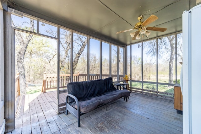 sunroom with plenty of natural light and ceiling fan