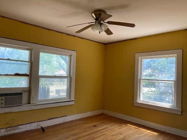 spare room featuring ceiling fan and light wood-type flooring