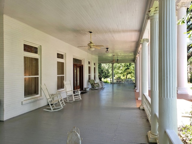 view of patio with ceiling fan and a porch