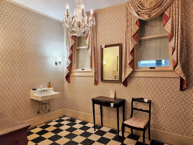 bathroom featuring tile floors, sink, and a chandelier