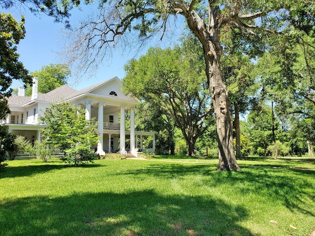 view of yard with covered porch