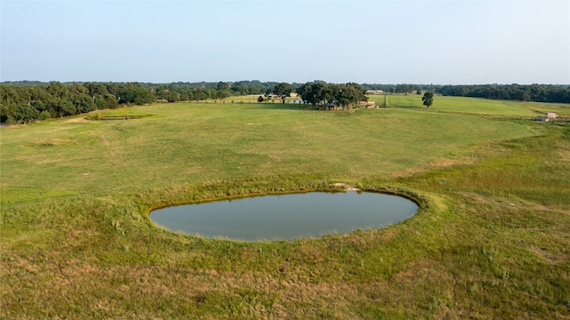 surrounding community with a water view, a rural view, and a yard