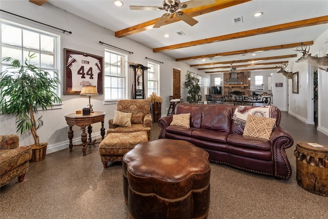 living room with beam ceiling and ceiling fan