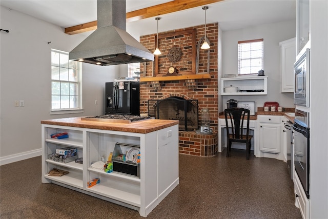 kitchen with a wealth of natural light, wooden counters, white cabinets, and island exhaust hood