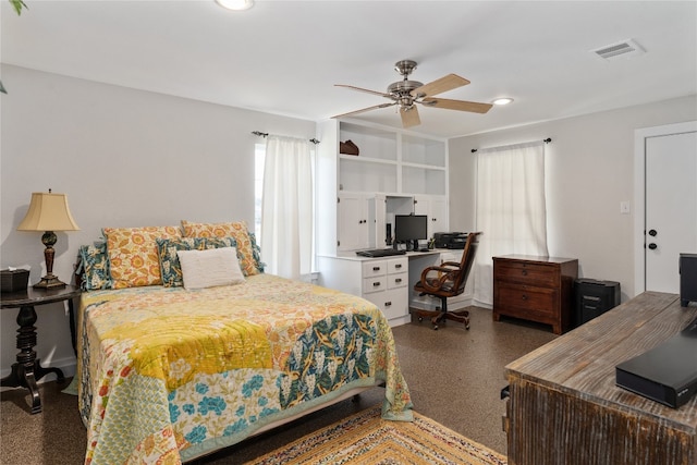 bedroom featuring ceiling fan and multiple windows