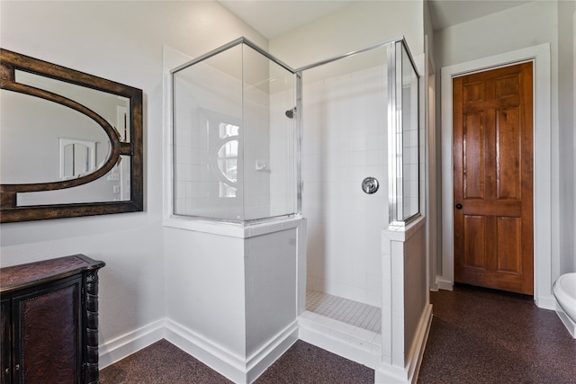 bathroom with tiled shower