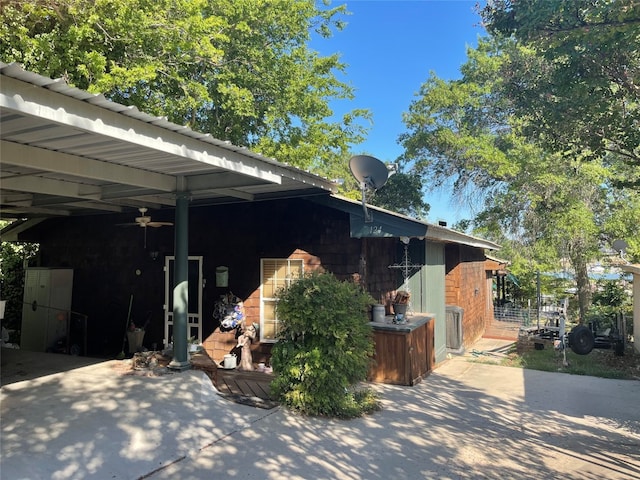 view of property exterior featuring a carport