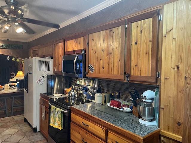 kitchen featuring backsplash, ornamental molding, stainless steel appliances, and ceiling fan