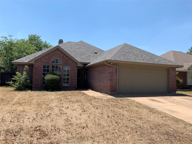 single story home featuring a garage