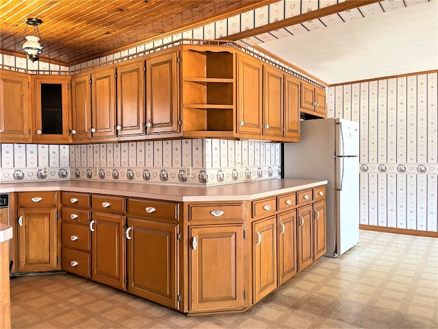 kitchen featuring white fridge, wooden ceiling, and light tile floors