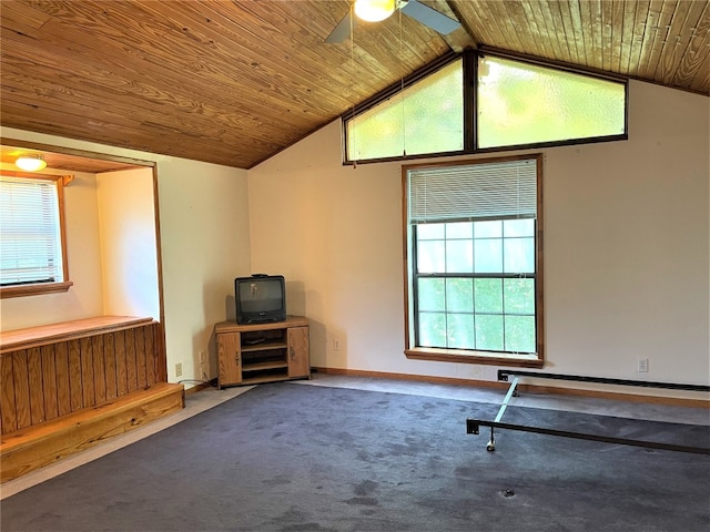 interior space featuring ceiling fan, vaulted ceiling, dark colored carpet, and wood ceiling