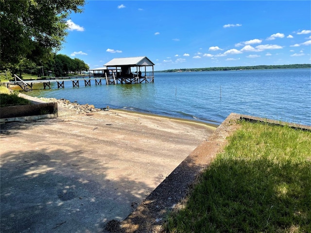 dock area featuring a gazebo and a water view