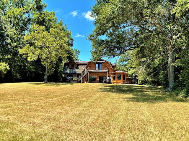 view of yard with a wooden deck