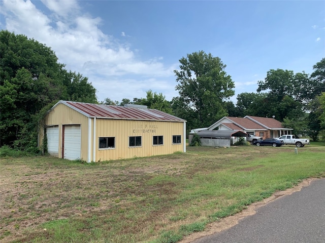 garage featuring a yard