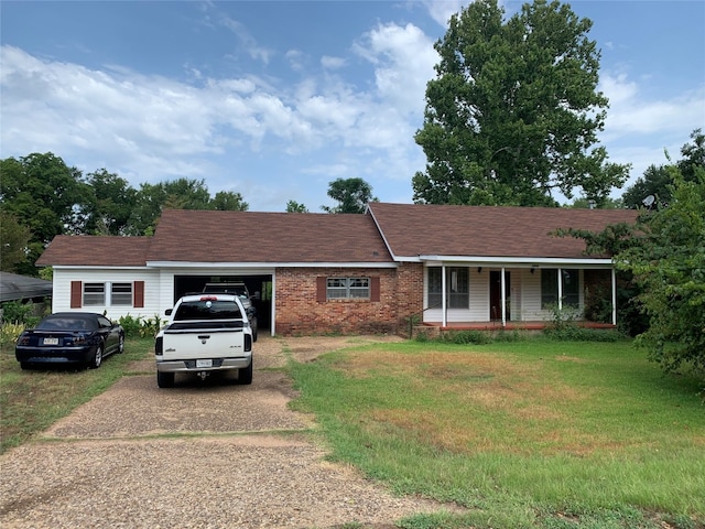 ranch-style house with a front lawn and a porch