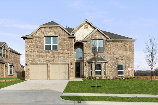 front facade featuring a front yard and a garage