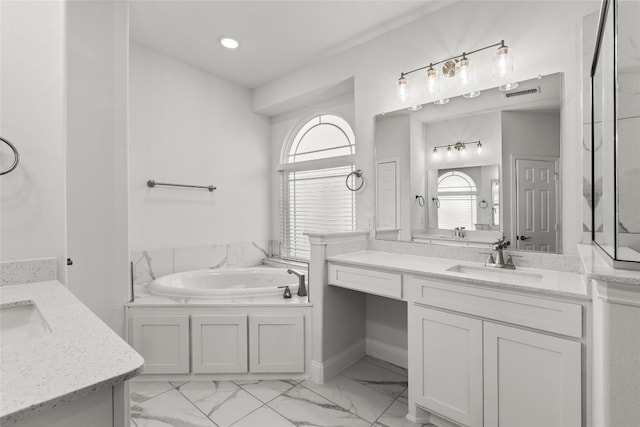 bathroom featuring a bath, vanity, tile flooring, and a healthy amount of sunlight