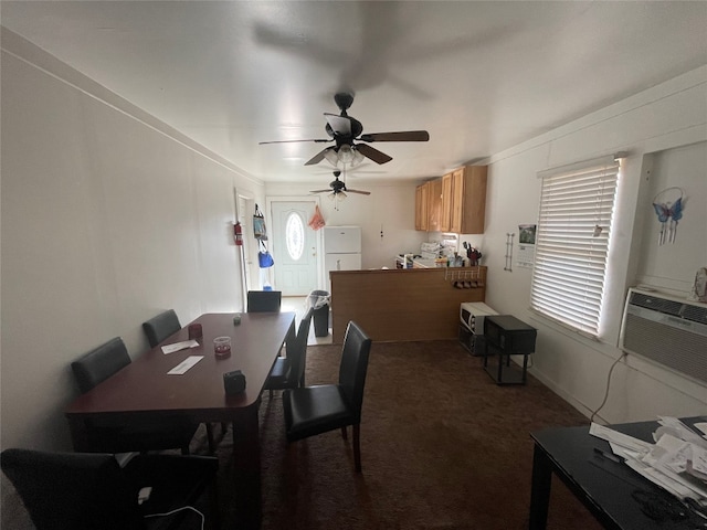 dining room with dark carpet and ceiling fan