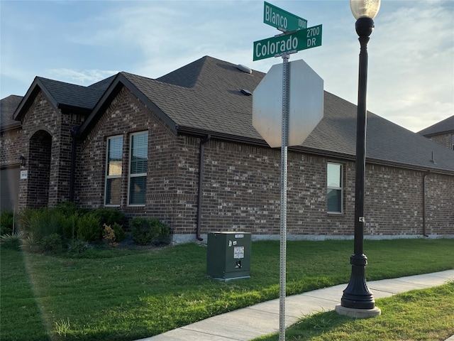 view of home's exterior featuring a yard