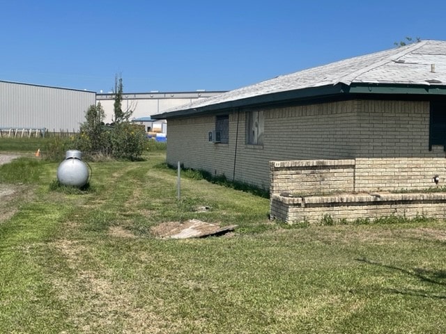 view of property exterior featuring a yard