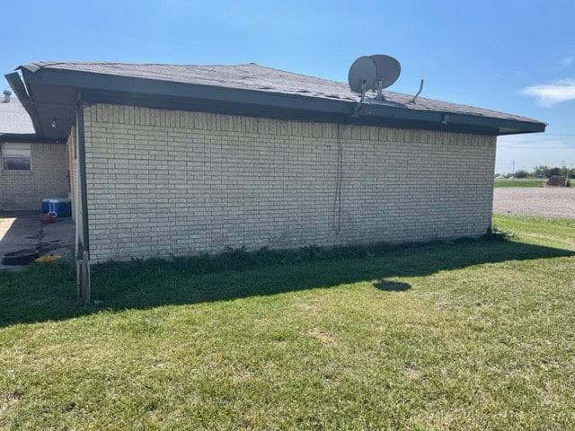 view of property exterior featuring a yard