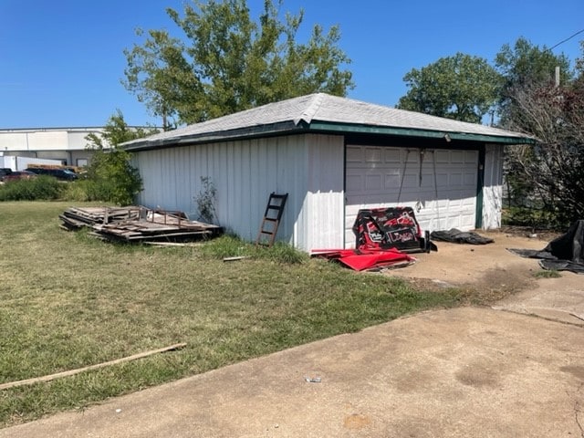 garage with a yard